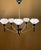 Brass chandelier with white opaline glass shades, rewired, in very good condition This piece is attributed to the...