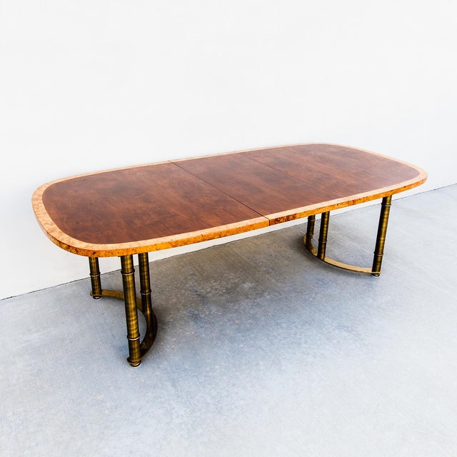 A large and expertly restored expandable dining table by Mastercraft, made in the USA in the 1970s. The tabletop consists...