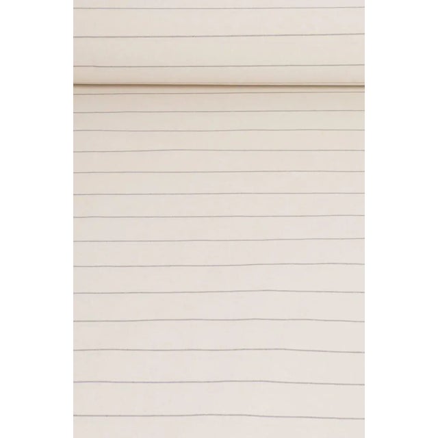 Cadiz is a woven double width fabric. Simple and classic, the coloured narrow stripe sits alongside an off-white base...