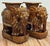 Vintage brown elephant garden stools featuring decorative garb with tasseled headdress and saddle draping. Wonderful...