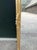 A glamorous pair of 1970 Italian Rococo-style full-length mirrors, beautifully designed with ornate antique gold frames...