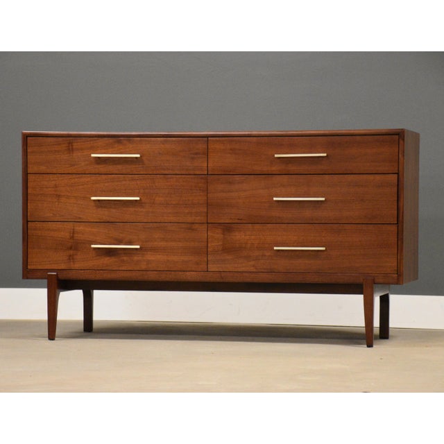 A mid century modern walnut six dovetail drawer dresser by Ramseur Furniture. Professionally refinished. Made in USA....