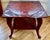 This is an exceptional antique Chinoiserie-style hardwood, brick-red lacquered center hall, occasional, or side table. The...