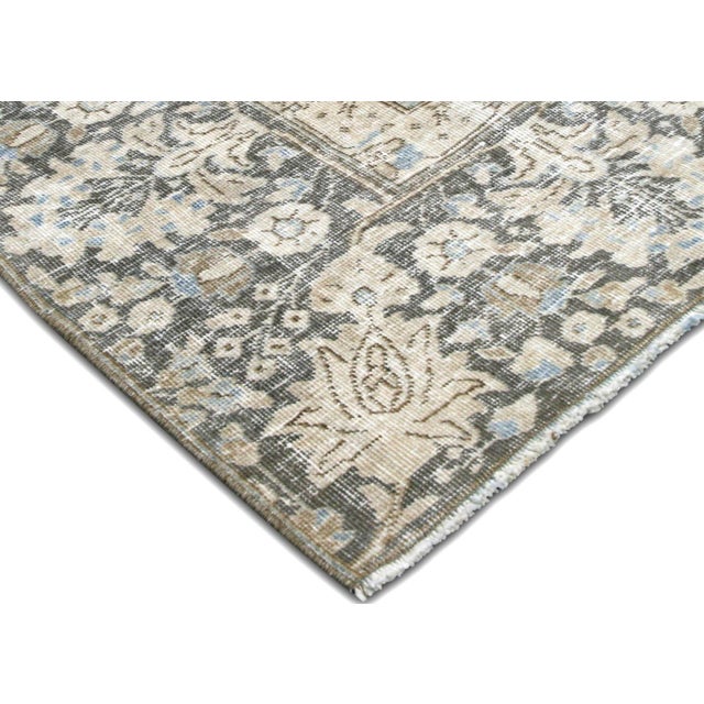 This Semi Antique Persian Tabriz Rug is expertly handwoven in the Tabriz region of Northern Iran. It has been distressed...