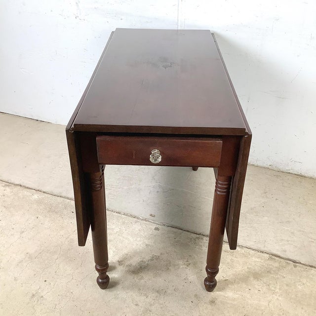 Few furniture forms capture the spirit of early American domestic life as completely as the drop-leaf table, and this...