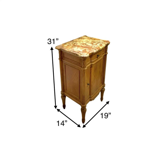 The vintage French style marble top table is a charming piece of hand-carved furniture with a unique antique appeal. The...