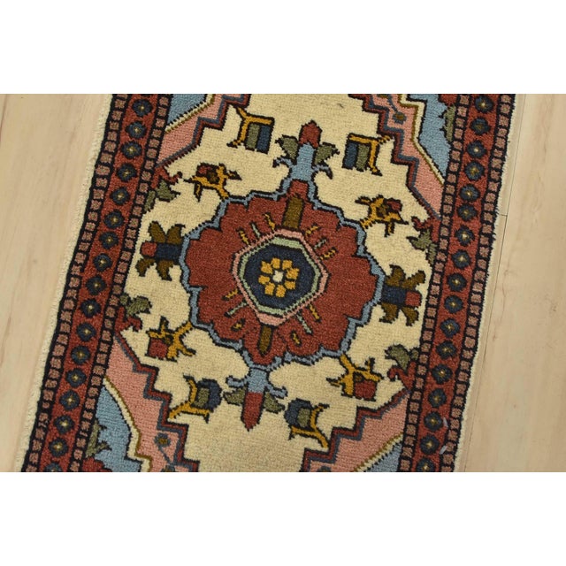 An authentic vintage tribal Meshkin rug hand-knotted with fine wool and natural dyes. This rug features a medallion set...