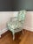 Louis XV Style French Bergere Chair. Reupholstered in beautiful floral pattern with matches the antique painted tone of...