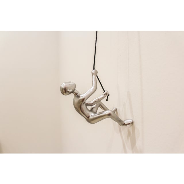 Our sleek Silver Climbing Man is a beautiful addition to your wall decor! Curate your own collection with our variety of...