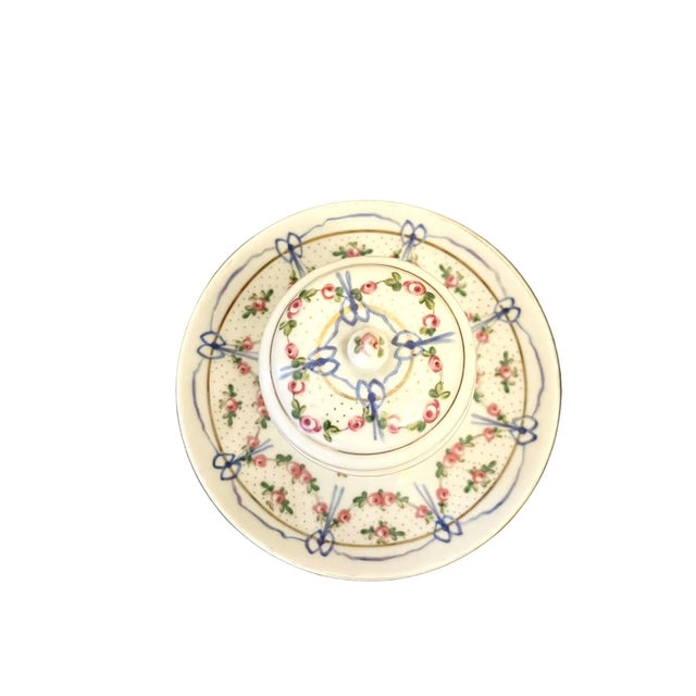 Beautifully decorated small bowl with lid and affixed to its saucer. Possibly it originally was an ink pot but can have so...