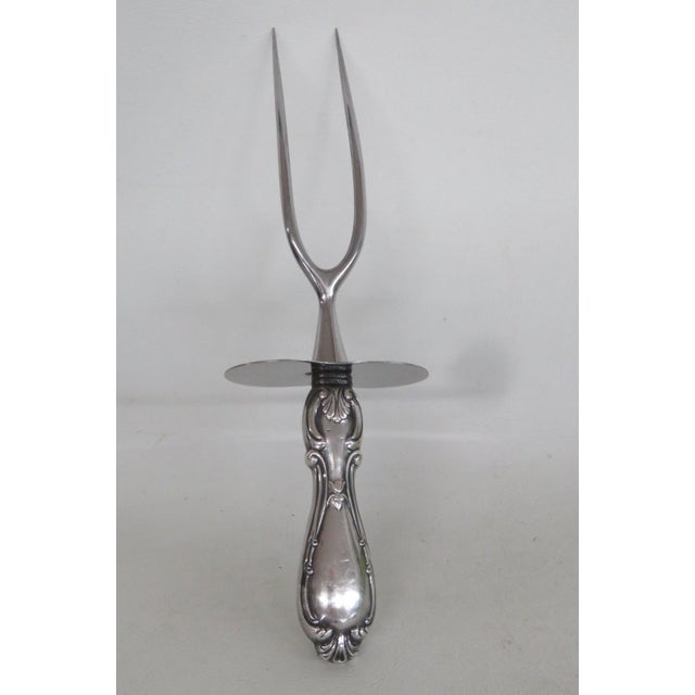 This gorgeous Roast Fork Serving Utensil is made out of stainless steel and weighted sterling. This carving utensil is...