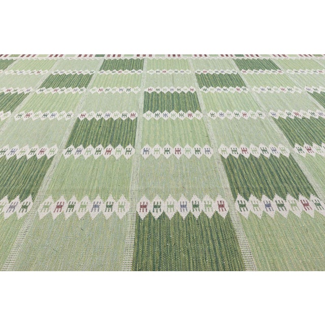 A captivating expression of Scandinavian craftsmanship, this large-scale modern Swedish flat weave rug is a masterclass in...