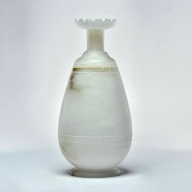 New Italian-made alabaster ewer in pale cream colored alabaster with narrow neck, fluted rim and contrasting brown...