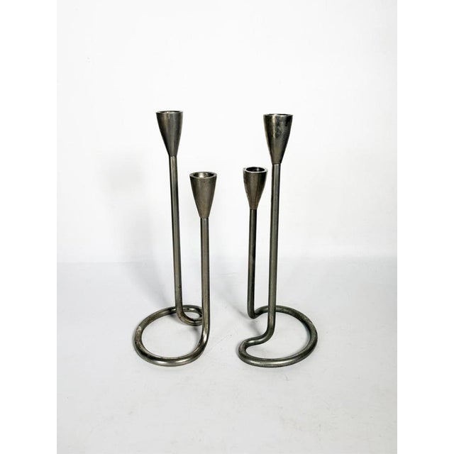 Pair of Scandinavian metal candlesticks with a clean and functional design, emblematic of the 1960s. Their slender...