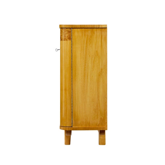 Scandinavian mid century elm and burr low open bookcase circa 1950. Fine quality Swedish made piece of furniture, which...
