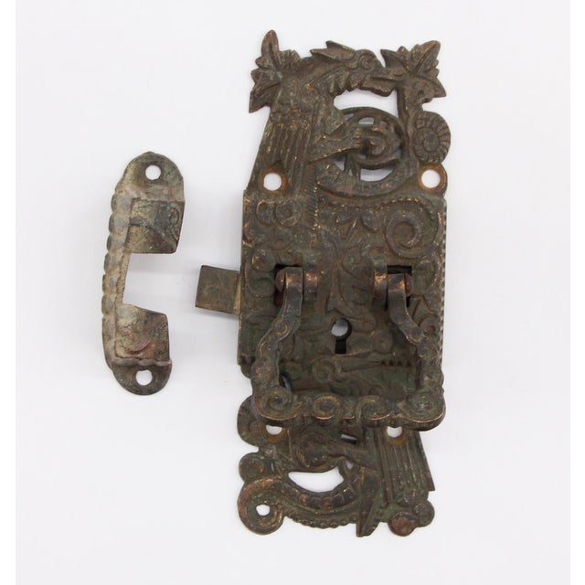 Large right swing Victorian bronze ice box latch with catch and griffin detail. Good condition with appropriate wear from...