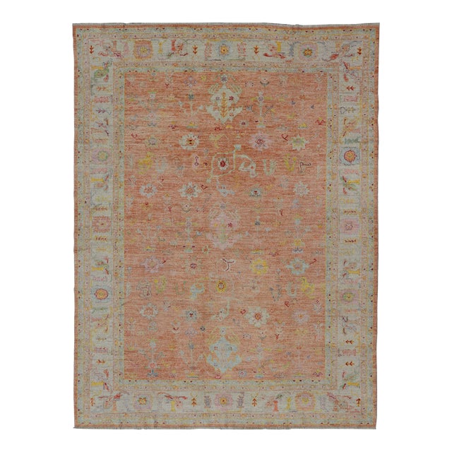 Vibrant Floral Medley on Salmon Pink Hand-Knotted Rug by Keivan Woven Arts For Sale
