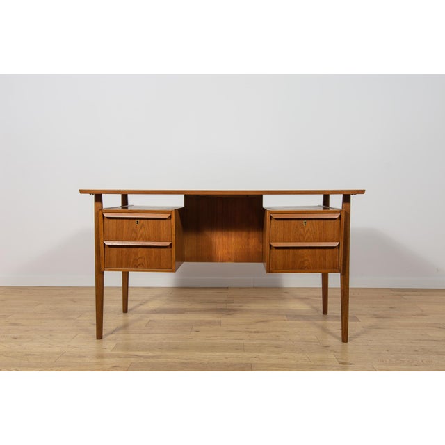This desk was designed by Gunnar Nielsen Tibergaard and manufactured in Denmark during the 1960s. The piece represents the...