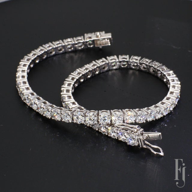 Here is a 10k White Gold Tennis Bracelet with Round White Lab-Grown Diamonds totaling ~10.26ctw with E/VVS2 grading....