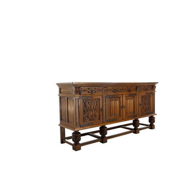 Spanish carved oak sideboard in the Neo-Renaissance style, circa 1950 A substantial Spanish sideboard crafted from solid...