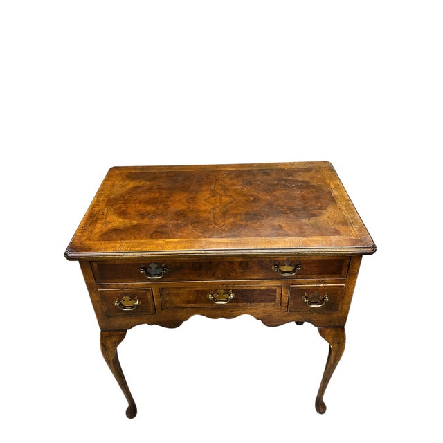 Vintage 1950s-1960s burlwood four drawer. server table. A center book matched veneer top surrounded by chevron pattern...