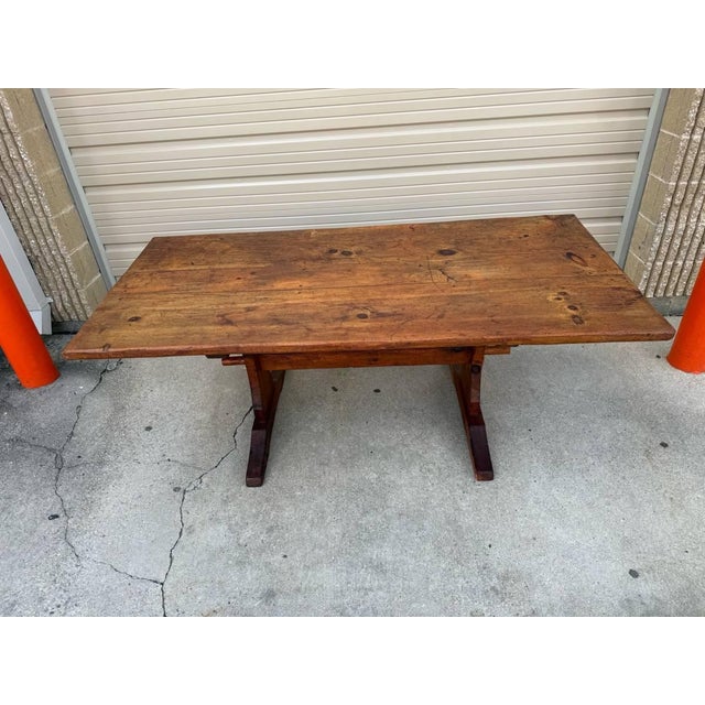 Antique 19th century Country farmhouse Style trestle base dining table This table has a pine frame with an unusual...