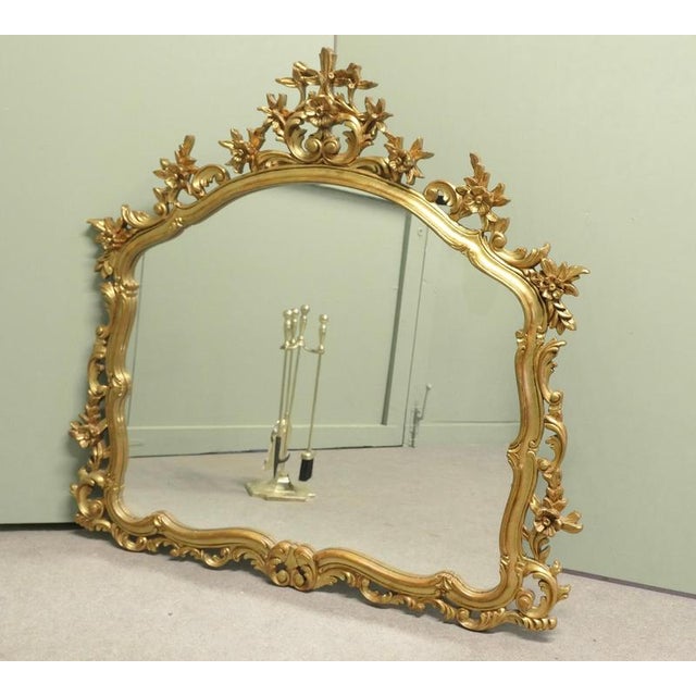 Large Rococo Style Gilt Wall Mirror The Mirror has an elaborate pierced gilt Frame in the Rococo Style, with flowers and...