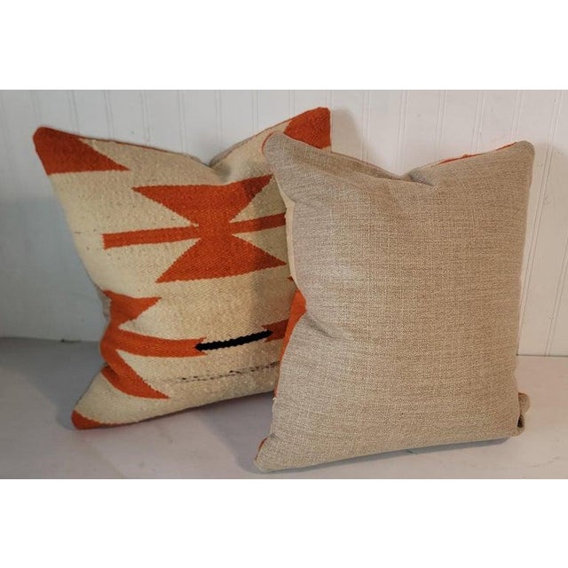 Navajo pair of geometric pillows. Wonderful orange color with a beige /white background. Each pillow has a wonderful...