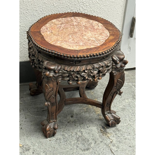 Design Plus Gallery presents an Antique Chinese Side Table/ Plant Stand. A 19th-century rosewood pedestal table with...