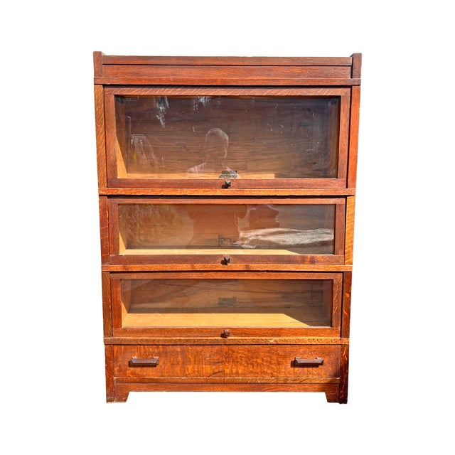 Antique Barrister Bookcase by Globe Wernicke in Tiger Oak Wood Beautiful bookcase with 3 sections and functional drawer....