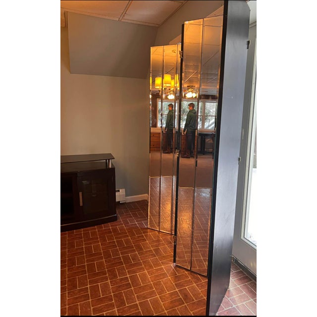 This striking vintage folding screen features multiple panels of thick beveled mirror glass, creating a dramatic, light-...