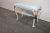 French style vanity bench , cast iron legs with cream and gold painted finish , light blue fabric seat