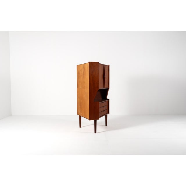 A lovely compact cabinet from the 1960s, made in Denmark in the Scandinavian modern style. The piece is built from warm...