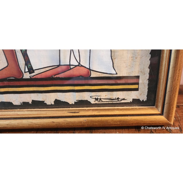 Vintage Framed Hand Painted Papyrus Egyptian Painting Of Horus leading Nefertiti into the afterlife ~ Signed, 1990s. Gilt...