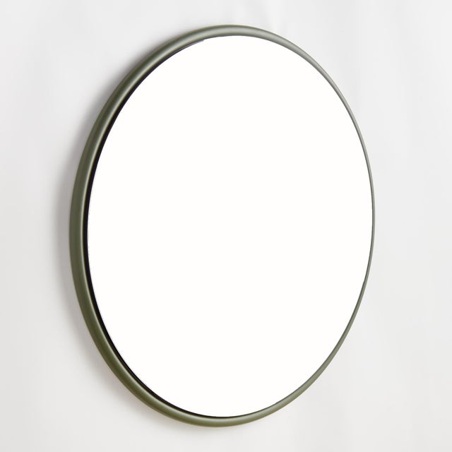 This sleek round iron stock frame in olive green is an inspired look. With a beveled edge, this stylish mirror creates a...