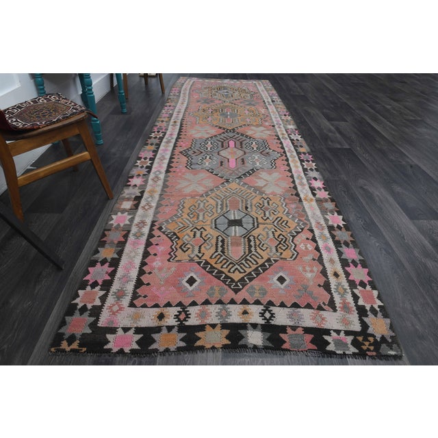 Vintage Hand-Knotted runner rug is a semi-antique vintage runner rug. The '70s Eastern region of Anatolia's unique rug is...