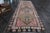 Vintage Hand-Knotted runner rug is a semi-antique vintage runner rug. The '70s Eastern region of Anatolia's unique rug is...