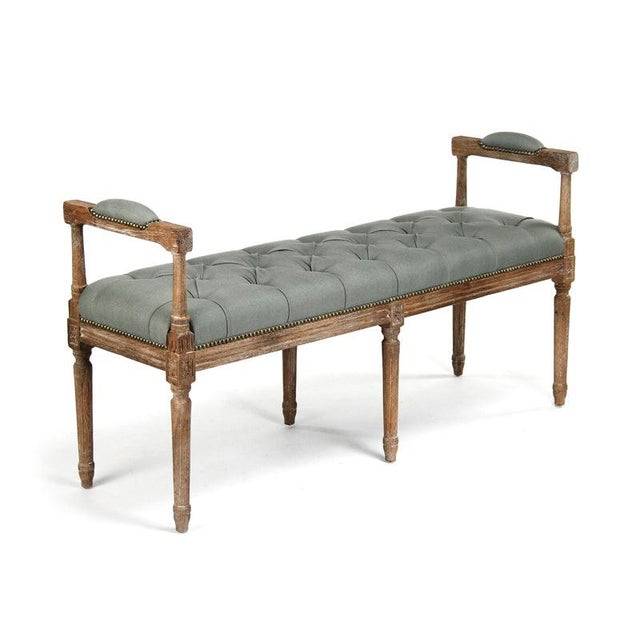 The Nicolas Tufted Bench has unique handles that are also cushioned. The bench is intricately carved from limed grey oak...