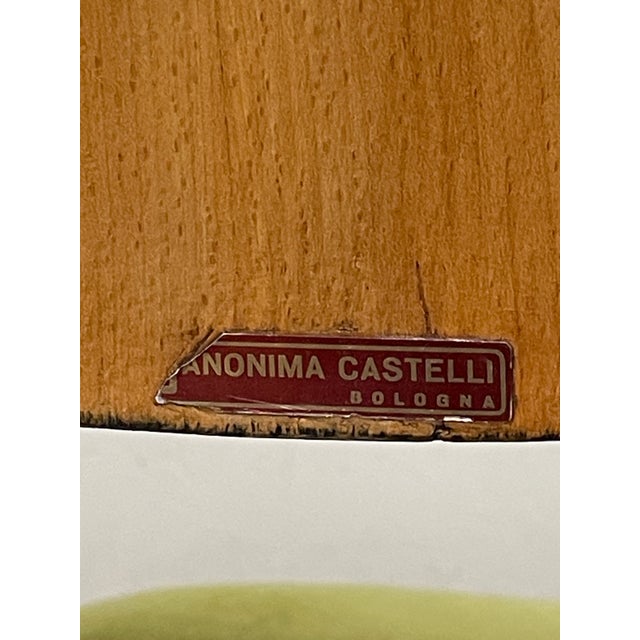 Set of four 1960s chairs by Anonima Castelli, known for their clean lines and comfortable seats. Beech frame with curved...