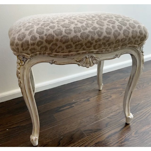 Upholstered antique Louis XV style benches with new animal print upholstery. Nice cream stool base with detailing. Cream...