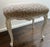 Upholstered antique Louis XV style benches with new animal print upholstery. Nice cream stool base with detailing. Cream...