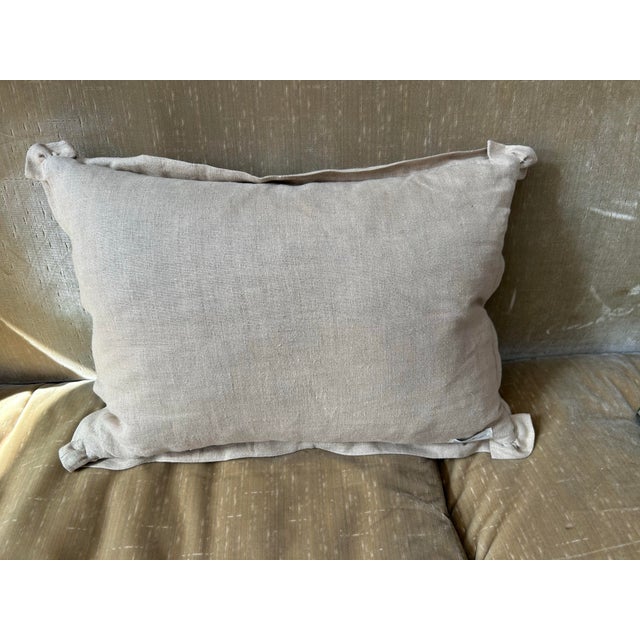 A pillow made from a 19th century printed fabric, backed with coordinating Irish linen, a down insert is included