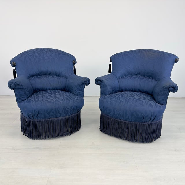 Dimensions: H 32.5” x W 31” x D 28” x SH 15.5” Pair of French Napoleon III style toad armchairs upholstered in original...