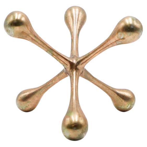 Circa 1960, we offer this sculptural Jack made in metal.