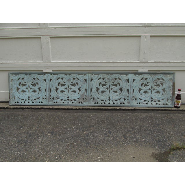 Antique transom panel circa 1900. Steel frame riveted to decorative aluminum panels. Original distressed paint. Six feet...