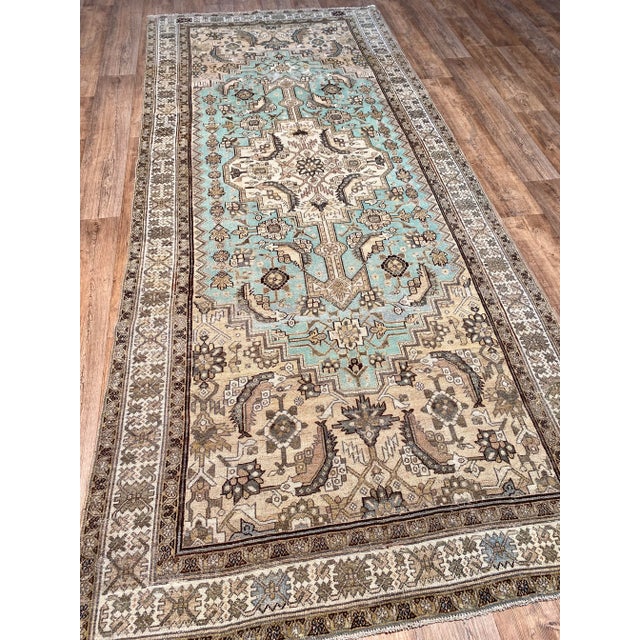 A fantastic antique Persian Bibikabad rug. This antique Bibikabad offers a neutral tan palette with light turquoise accents.