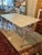 A rare late 19th century French butcher table — cast iron base with a double bull's head and original marble top. Measures...