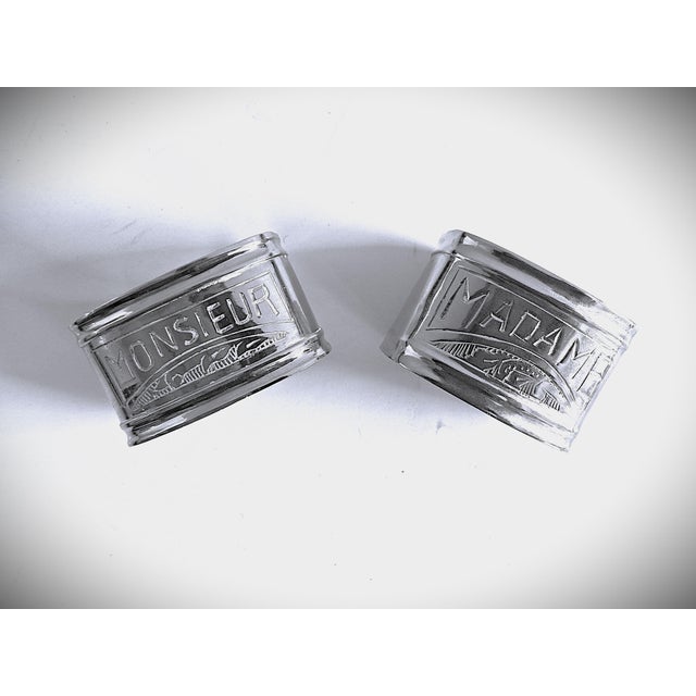 Here are a beautiful pair of "Madame & Monsieur" silver-plated napkin rings, a classic French design often dating from the...