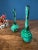A rare and elegant pair of vintage Czech malachite glass perfume bottles, crafted in rich emerald green pressed glass with...