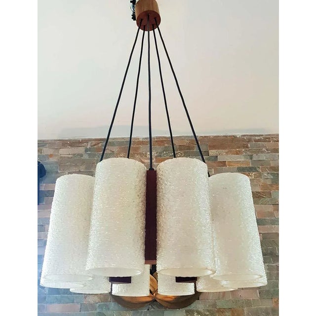 Danish teak chandelier with ten lampshade tubes of synthetic resin. For 10 E14 bulbs. European Plug (up to 250V).The...